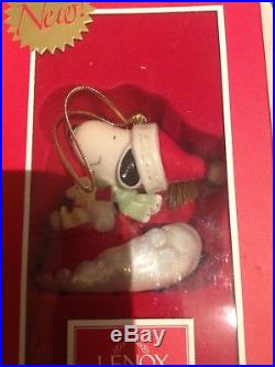 Four Snoopy Christmas ornaments Lenox China Plus One Crystal Ornament